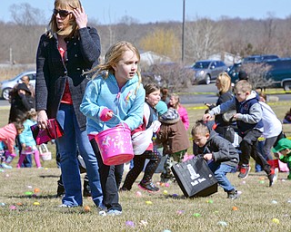 Maci Sankey, age 6, hunts for Easter eggs at Rulli Brothers in Boardman on March 18, 2018.  Her mom Jen Sankey, of New Castle, is right behind her to help.

Photo by Scott Williams - The Vindicator.