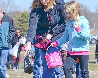 Maci Sankey, age 6, hunts for Easter eggs at Rulli Brothers in Boardman on March 18, 2018.  Her mom Jen Sankey, of New Castle, is right behind her to help.

Photo by Scott Williams - The Vindicator.