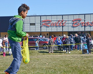 Isaiah Franklin, age 9, hunts for one last egg at Rulli Brothers in Boardman on March 18, 2018.  Franklin was brought to the event with is neighbor Christy Christoff, of Boardman.

Photo by Scott Williams - The Vindicator.