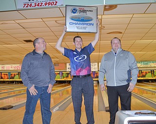 PBA bowler Matt O'Grady, from Rahway, NJ, holds up his award after winning the PBA Trumbull County Tourism Bureau Central/East Open at Bell Wick Bowling Alley in Hubbard, Ohio on Sunday, March 18, 2018.  To his left is host Jim Bryant, of Liberty, and to his right is host Scott Killian, who is a Hubbard bowling coach.

Photo by Scott Williams - The Vindicator.