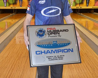 PBA bowler Matt O'Grady, from Rahway, NJ, holds up his award after winning the PBA Trumbull County Tourism Bureau Central/East Open at Bell Wick Bowling Alley in Hubbard, Ohio on Sunday, March 18, 2018.

Photo by Scott Williams - The Vindicator.