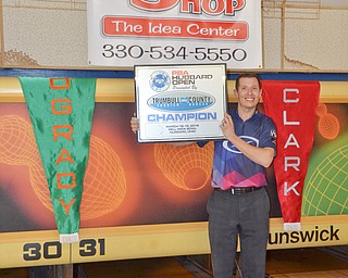 PBA bowler Matt O'Grady, from Rahway, NJ, holds up his award after winning the PBA Trumbull County Tourism Bureau Central/East Open at Bell Wick Bowling Alley in Hubbard, Ohio on Sunday, March 18, 2018.

Photo by Scott Williams - The Vindicator.