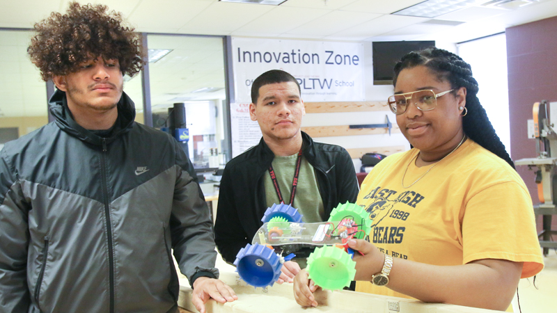 Choffin Career & Technical Center engineering students Lorenzo Flowers, left, Samuel Nazarro Rivera and Rhea Dowell-Betts built a model Mars rover as part of a competition to design wheels ideal for exploring Mars’ sandy terrain. The class will head to the NASA Glenn Research Center in Cleveland as finalists in the competition in April.