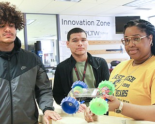 Choffin Career & Technical Center engineering students Lorenzo Flowers, left, Samuel Nazarro Rivera and Rhea Dowell-Betts built a model Mars rover as part of a competition to design wheels ideal for exploring Mars’ sandy terrain. The class will head to the NASA Glenn Research Center in Cleveland as finalists in the competition in April.