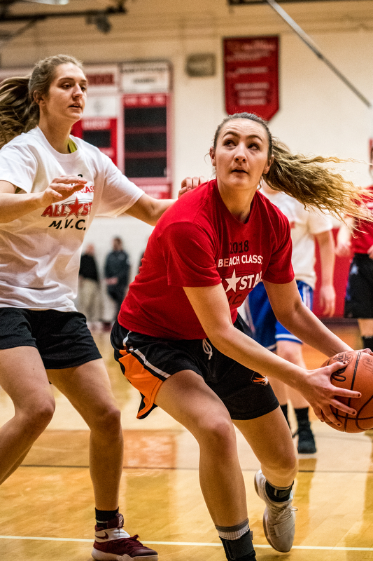 Newton Falls' Izzy Kline looks to the basket as South Range's Maddie Durkin defends during the Al Beach All-Star Classic at Canfield High School on Tuesday..
