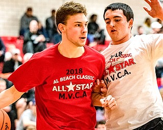 LaBrae’s Aaron Iler drives the baseline against West Branch’s Michael Boosz during the Al Beach All-Star Classic on Tuesday at Canfield High School.