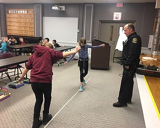 Neighbors | Submitted .While wearing the Fatal Vision Goggles, Boardman Center Intermediate School fifth-graders use arms to balance but still can’t walk a straight line.