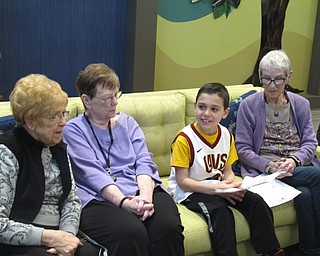Neighbors | Zack Shively.Union Elementary students did an assignment where they explained what was most precious to them in their lives. Four students then went over the answers with residents of the The Inn at Poland Way. Pictured, Colin Sacui read different answers to the residents.