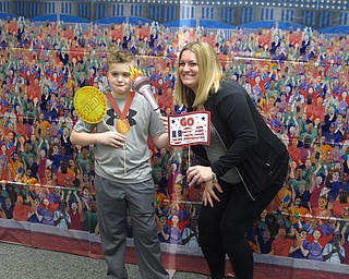 Neighbors | Zack Shively.The PTO organized an area for mothers and sons to take pictures together with decorations in front of a mural. Pictured, Aiden and his mom Lindsay posed for their pictured.