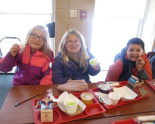 Neighbors | Zack Shively.The Austintown Elementary School breakfast and lunch had foods named after Dr. Seuss stories, such as strawberry milk named “pink ink“ during breakfast and lunch, a reference to the pink ink the Yink drinks in “One Fish, Two Fish, Red Fish, Blue Fish.“ Pictured are, from left, Madison Eckert, Angelina Rusu and Breston Smith enjoying their green eggs and ham.