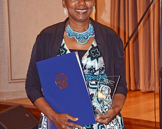Dr. Sherri Harper Woods stands with her Campus Leadership award and award from the State of Ohio at the Diversity Leadership Recognition Dinner at Stambaugh Tyler Grand Ballroom on Thursday, March 22, 2018.

Photo by Scott Williams - The Vindicator