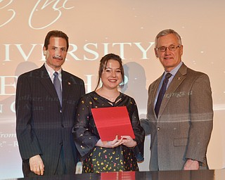 Diversity Leadership Scholarship recipient Riley K. Chiu stands between YSU Provost VP Academic Affairs Martin Abraham, left, and YSU President James P. Tressel at the Diversity Leadership Recognition Dinner at Stambaugh Tyler Grand Ballroom on Thursday, March 22, 2018.

Photo by Scott Williams - The Vindicator