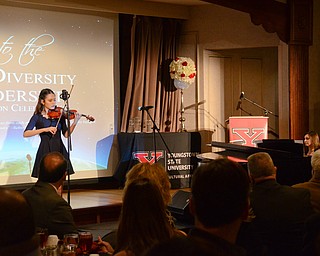 Natalie P. Nguyen, Freshman, Theater and Music Major, Cochran Scholar, and YSU student from Hanoi, Vietnam, and piano accompanist Mrs. Emilie Eberth, coordinator, STEM Outreach and Scholarships, perform at the Diversity Leadership Recognition Dinner at Stambaugh Tyler Grand Ballroom on Thursday, March 22, 2018.

Photo by Scott Williams - The Vindicator