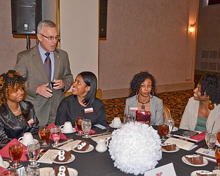 Youngstown State President James P. Tressel chats with (L-R) Jasmine Harper, sophomore, Nylauna Petty, freshman, Shantia Cox, sophomore, and Jasmine Smyles, sophomore, who are Navarro Executive Fellows at the Diversity Leadership Recognition Dinner at Stambaugh Tyler Grand Ballroom on Thursday, March 22, 2018.

Photo by Scott Williams - The Vindicator