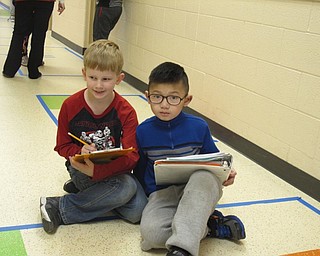 Neighbors | Zack Shively.Each of the grades at Austintown Intermediate School took on math-related names, such as the fourth grade on the second floor becoming Angle City for Math Day. The school, as a whole, named themselves Mathopolis. Pictured, third-grade students Ryan Akers and Alan Lin completed a math activity in the Arrayville, or third grade, hallway.