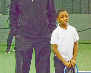 Bob Hannon, president of the United Way of Youngstown, shares a moment with 8 year old Coreyae Reese at the Boardman Tennis Center on March 23, 2018. 

Photo by Scott Williams - The Vindicator