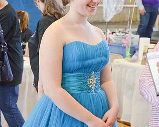 Amanda Johnson, age 17, from the Meadville, PA area, tries on a blue dress at the Kyrsten's Kloset event at Roosevelt Elementary School in Hubbard, Ohio on March 24, 2018.

Photo by Scott Williams - The Vindicator