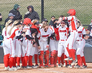 Lexi Zappitelli, #23, leaps in the air as she's about to be mobbed by her teammates after hitting one over the fence during game two against Indiana University-Purdue University Indianapolis March 24, 2018 at the Covelli Sports Complex at Youngstown State University.

Photo by Scott Williams - The Vindicator.