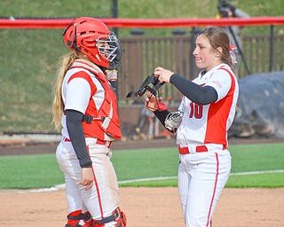 Nikki Saibene, #13, left, calls time for a trip to the mound to see Maddi Lusk, #10, during game two against Indiana University-Purdue University Indianapolis March 24, 2018 at the Covelli Sports Complex at Youngstown State University.

Photo by Scott Williams - The Vindicator