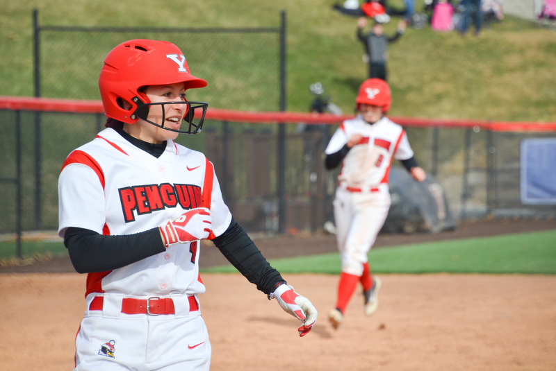 Cali Mikovich, #4, smiles as she crosses home plate as Alexis Roach, #8, rounds third in the background during game two against Indiana University-Purdue University Indianapolis March 24, 2018 at the Covelli Sports Complex at Youngstown State University.

Photo by Scott Williams - The Vindicator.