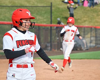 Cali Mikovich, #4, smiles as she crosses home plate as Alexis Roach, #8, rounds third in the background during game two against Indiana University-Purdue University Indianapolis March 24, 2018 at the Covelli Sports Complex at Youngstown State University.

Photo by Scott Williams - The Vindicator.