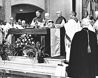 Archbishop Alter, principal concelebrant of the funeral Mass is assisted by his chaplains, Msgr. Lettau (left) and Msgr. Gallagher (right).  Surrounding the main altar are Ohio bishops who concelebrated the Mass with the archbishop.  From the left they are: Bishop Clarence G. Issenman of Cleveland, Auxiliary Bishop E. A. McCarthy of Cincinnati, Auxiliary Bishop Clarence Elwell of Cleveland, the archbishop and chaplains, Bishop George A. Rehring, retired bishop of Toledo, Bishop John King Mussio of Steubenville, and the Most Rev. James W. Malone, apostolic administrator of the Diocese of Youngstown.

Photo taken March 23, 1968.

Photo by Paul R. Schell.