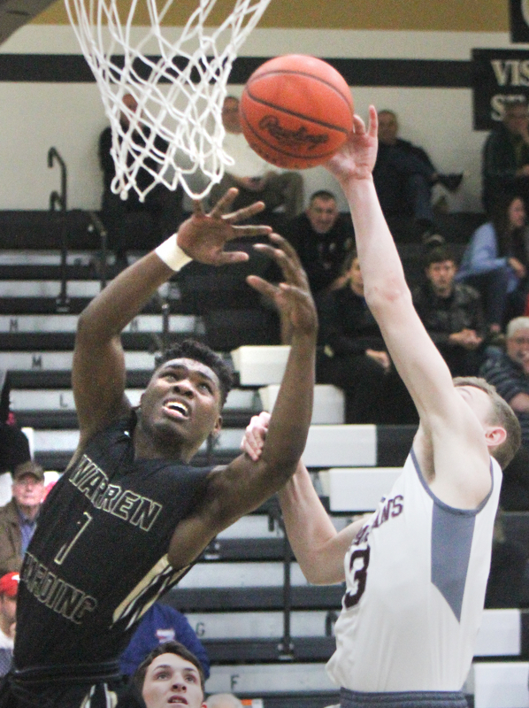 William D. Lewis The vindicator  Harding's Terrion Jackson(1) and Boardman's Holden Lipke(3) go for a rebound during Bubba action at Warren Harding.