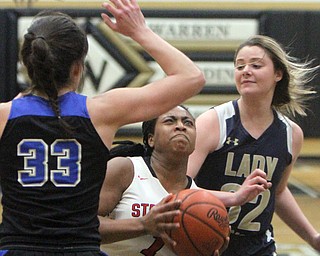 William D. Lewis The vindicator  Lakeview's Annie Pavlansky(33)  and Brookfield's Tori Sheehan (32) defend against Struthers Khaylah Brown(1) during Bubba action at Warren Harding.