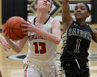 William D. Lewis The vindicator  Struthers Alexis Bury(13) shoots past HArding's Brayleonna Wood(1) during Bubba action at Warren Harding.