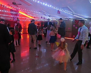 Neighbors | Zack Shively.The Father Daughter Dance at Boardman Park had a DJ and a dance floor. The event ended with a rose ceremony, where the daughters receive roses and a dance to the song "My Girl" by the Temptations.