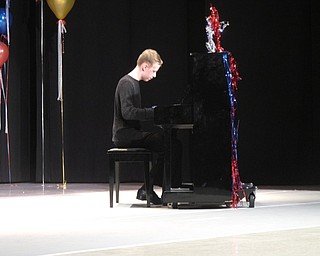 Neighbors | Zack Shively.The Austintown Middle School PTA organized the talent show. They wanted to give students a chance to show their abilities outside of a formal school activity. Pictured, Morgan Maxim played the piano during the show.