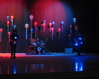 Neighbors | Zack Shively.The AMS PTA decorated, lit and ran the talent show in the middle school's cafetorium. Pictured, Blue Flare, a rock band of AMS students, performed Enter Sandman to open the talent show.