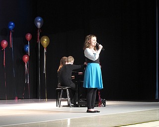 Neighbors | Zack Shively.The Austintown Middle School talent show had 31 students in 26 different acts. Some students performed alone, others as a duet or trio. Pictured, Aeryonnah Zura sang "Part of Your World" from Disney's "The Little Mermaid" with a piano accompaniment from Madison Sheffield.