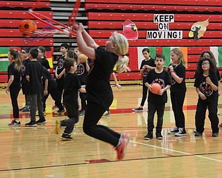 Neighbors | Abby Slanker.A C.H. Campbell Elementary School third-grade student showed off her basketball slam dunk skills at the school’s annual Third Grade Gym Show in the high school gymnasium on March 8.