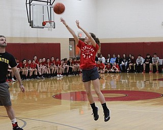 Neighbors | Abby Slanker.A member of the Canfield Village Middle School seventh-grade girls basketball team took shot during the school’s annual students versus staff basketball game on March 9.