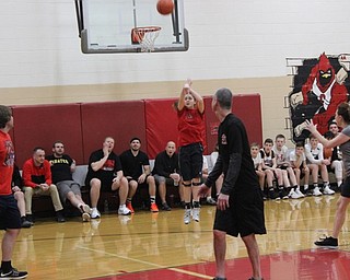 Neighbors | Abby Slanker.A member of the Canfield Village Middle School eighth-grade girls basketball attempted a three point shot during the school’s annual students versus staff basketball game.