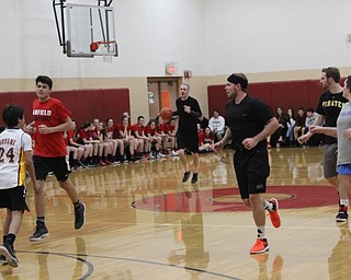 Neighbors | Abby Slanker.Members of the Canfield Village Middle School staff team hustled down the court during the school’s annual students versus staff basketball game.