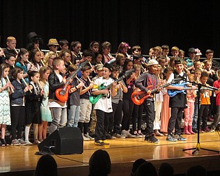 Neighbors | Zack Shively.The fourth-grade concert had a "star" theme, so the students dressed as rock stars, athletes and other famous stars. Pictured, students played Bon Jovi's "It's My Life" while other students danced on stage like guitarists.