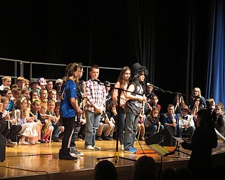 Neighbors | Zack Shively.Between each song that the fourth-graders sang at their concert, students came up to the microphone to speak. These sections of dialogue bridged the gap between songs, introduced the next song and created a story for the concert.