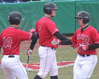 William D. Lewis The VindicatorYSU's Drew Dickerson(30),gets congrats from Nick Massey(12) and Trey Bridis(2) after scoring on a single by Cody Dennis(10) during 3-30-18 game at Eastwood.