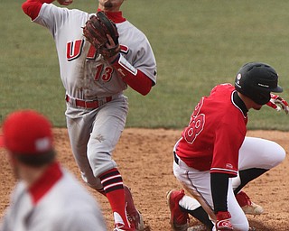 William D. Lewis The VindicatorYSU's Zach Lopatka(28) is out at 2nd as UIC's Ryan Lin-Peistrup(13) attempts to turn a double during 3-30-18 game at Eastwood.