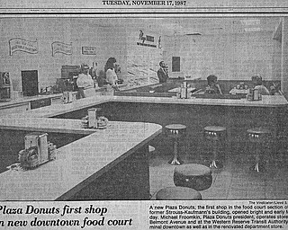 PLAZA DONUTS FIRST SHOP IN NEW DOWNTOWN FOOD COURT - A new Plaza Donuts, the first shop in the food court section of the former Strouss-Kaufmann's building, opened bright and early Monday.  Michael Froomkin, Plaza Donuts president, operates stores on Belmont Avenue and at the Western Reserve Transit Authority terminal downtown as well as in the renovated department store.

Photo taken Monday November 16, 1987.

Photo by Lloyd S. Jones - The Vindicator.