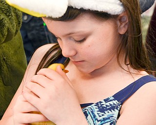 Loyal Davis, 8, from Mt. Vernon, OH, holds a baby chick at the Marian Assisted Living Center at Mercy's Assumption Village campus in North Lima on Saturday March 31, 2018.  Davis attended the event with her grandpa Charles Whippo and grandpa Donna. 

Photo by Scott Williams - The Vindicator.