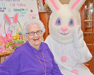 Bea Schroeder, a resident of the Marian Assisted Living Center at Mercy's Assumption Village campus in North Lima, is all smiles after getting to meet the Easter Bunny on Saturday March 31, 2018.

Sydney Turney, a Boardman High School student, wore the bunny costume for National Honor Society hours.

Photo by Scott Williams - The Vindicator