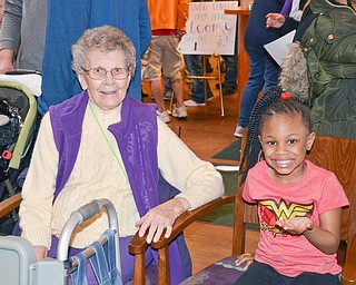 Helen Karash, left, 97, sits with her new friend Laryan Morris's, 5, at the Marian Assisted Living Center at Mercy's Assumption Village campus in North Lima on Saturday March 31, 2018. Morris attended the event with her mom Laqualyn Morris of Youngstown.

Photo by Scott Williams - The Vindicator