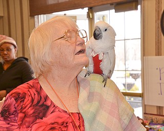 Eunice Lucyk is delighted by Nick Carano's bird Ouija at the Marian Assisted Living Center at Mercy's Assumption Village campus in North Lima on Saturday March 31, 2018.

Photo by Scott Williams - The Vindicator