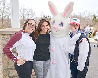 From left to right, Angelina Holzschuh, 17, Jennah Markovitch, 17, and Mikel Flatley, 17, pose with the Easter Bunny at the Marian Assisted Living Center at Mercy's Assumption Village campus in North Lima on Saturday March 31, 2018.  The girls, including Sydney Turney, who wore the bunny costume, are students at Boardman High School and volunteered at the event for National Honor Society hours.

Photo by Scott Williams - The Vindicator