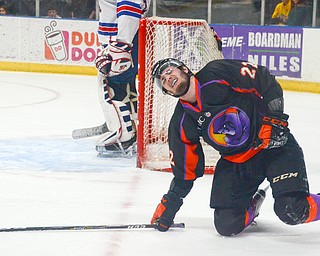 Dalton Messina, #22, of the Youngstown Phantoms is on his knees in pain after being slammed into the wall pretty hard at the Phantoms vs. Team USA game at the Covelli Centre on March 31, 2018...Photo by Scott Williams Ð The Vindicator.