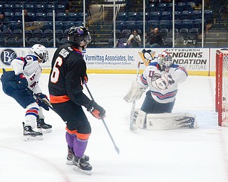 .Marshall Warren, #37, and Cameron Rowe, #31, from Team USA sit back and watch as Max Ellis, #6, from the Youngstown Phantoms puts the puck in the goal at the Phantoms vs. Team USA game at the Covelli Centre on March 31, 2018...Photo by Scott Williams Ð The Vindicator.