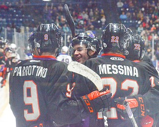 Max Ellis, #6, center, receives some love from his teammates after making a goal at the Phantoms vs. Team USA game at the Covelli Centre on March 31, 2018...Photo by Scott Williams Ð The Vindicator.